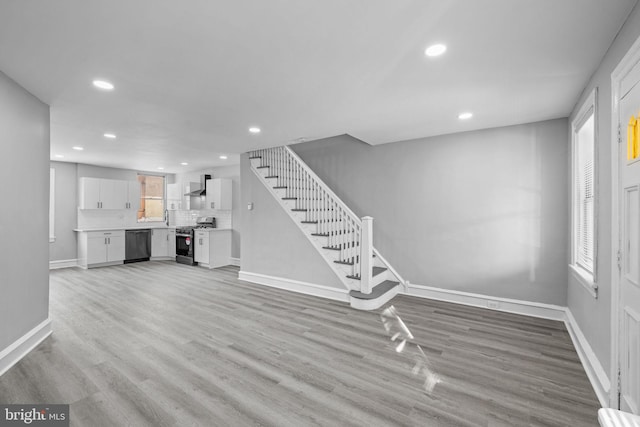 foyer entrance with light hardwood / wood-style flooring