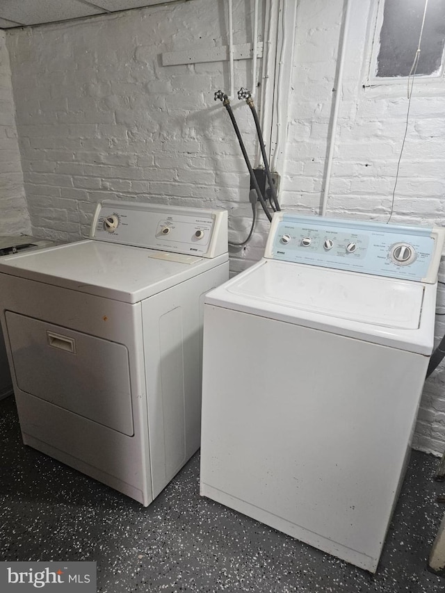 laundry room featuring washing machine and dryer