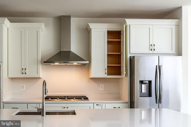 23671 Hardesty Ter, Ashburn, VA 20148 - kitchen with stainless steel appliances, wall chimney range hood, open shelves, light countertops, and white cabinetry