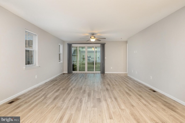 spare room featuring ceiling fan and light hardwood / wood-style flooring