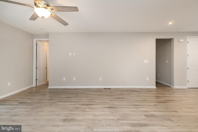 unfurnished room featuring ceiling fan and light hardwood / wood-style flooring