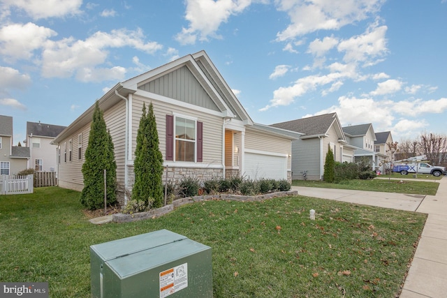 view of front of house with a front yard and a garage