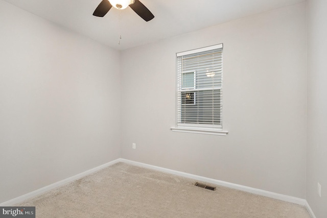 empty room with carpet and ceiling fan