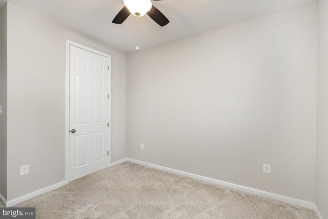 unfurnished bedroom with ceiling fan and light carpet