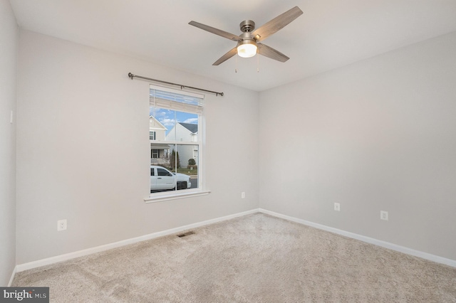 empty room with light carpet and ceiling fan