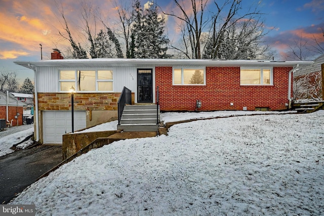 view of front of property featuring a garage