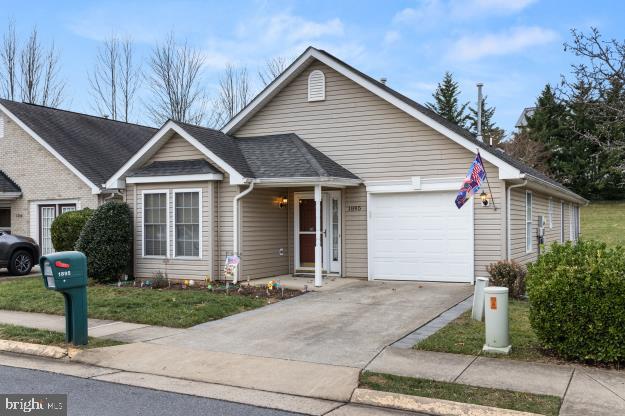 single story home featuring a garage