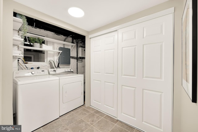 clothes washing area with electric panel and washer and clothes dryer