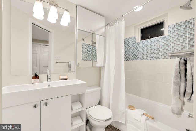 full bathroom with vanity, toilet, and shower / bath combo with shower curtain