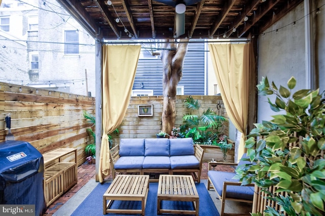 view of patio featuring an outdoor hangout area and fence