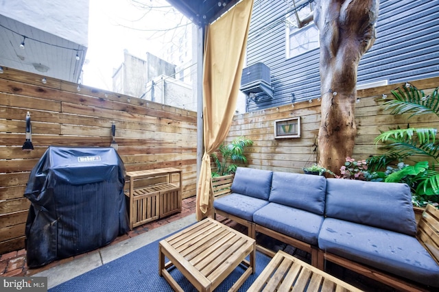 view of patio / terrace featuring outdoor lounge area, fence, and area for grilling