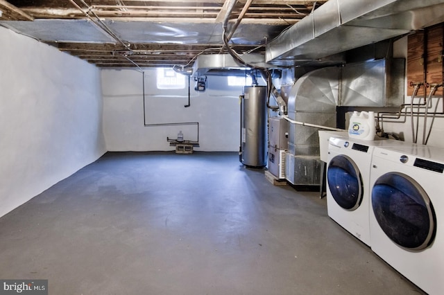 below grade area with gas water heater and washer and dryer