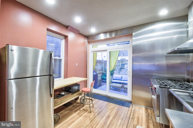 kitchen with stainless steel appliances, light wood-type flooring, and recessed lighting