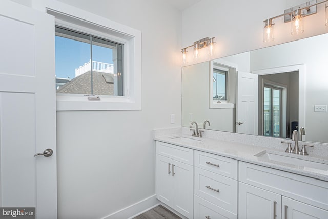 bathroom featuring hardwood / wood-style flooring and vanity