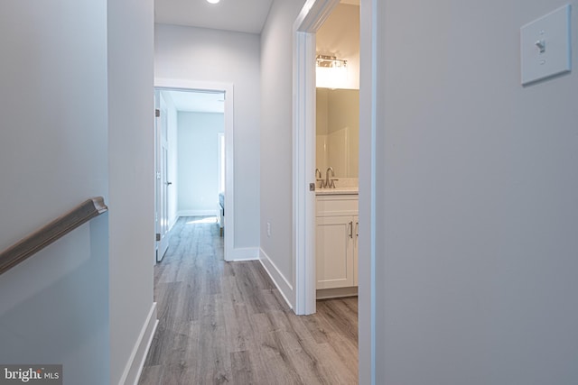 hall with light wood-type flooring