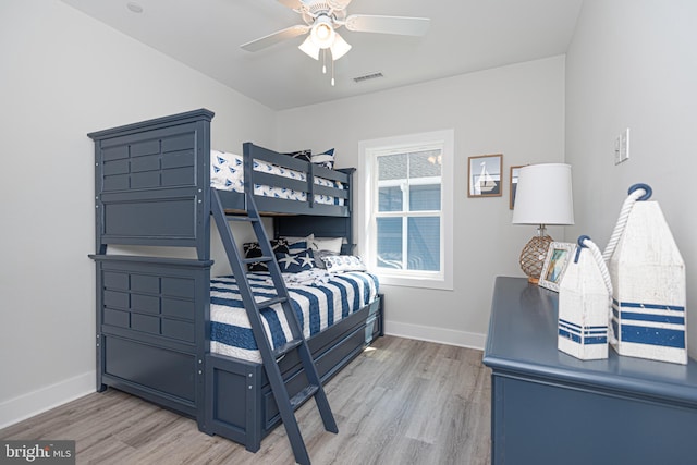 bedroom with hardwood / wood-style flooring and ceiling fan