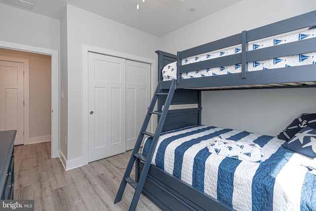 bedroom featuring light hardwood / wood-style flooring and a closet