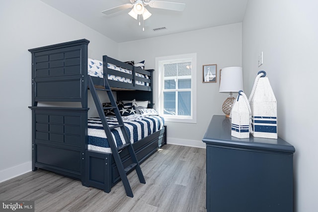 bedroom with hardwood / wood-style flooring and ceiling fan