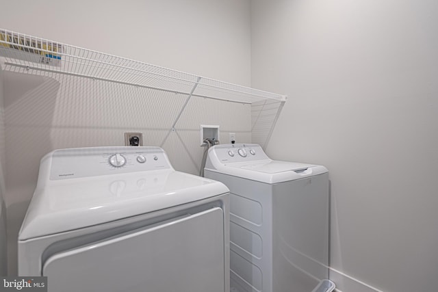 laundry area with washing machine and dryer