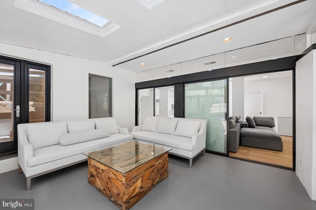 living room with recessed lighting, a skylight, visible vents, and finished concrete floors