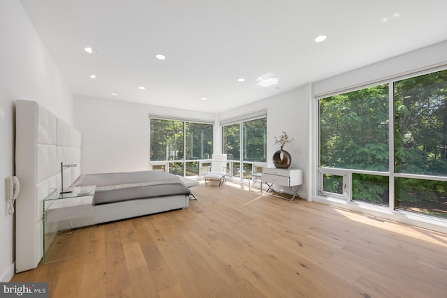 unfurnished bedroom with light wood-type flooring and recessed lighting