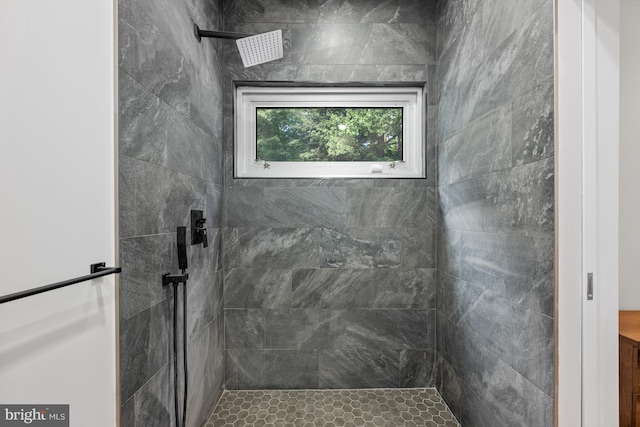 full bathroom with a tile shower