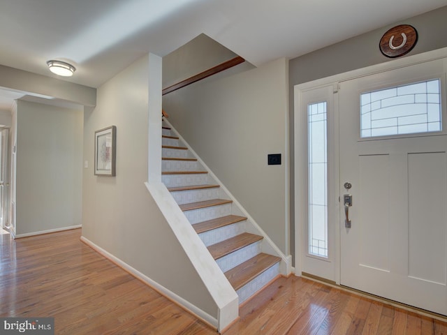 foyer entrance featuring a healthy amount of sunlight and light wood-type flooring