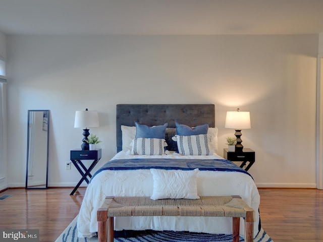 bedroom featuring wood-type flooring