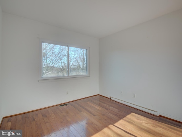 empty room with light wood-type flooring