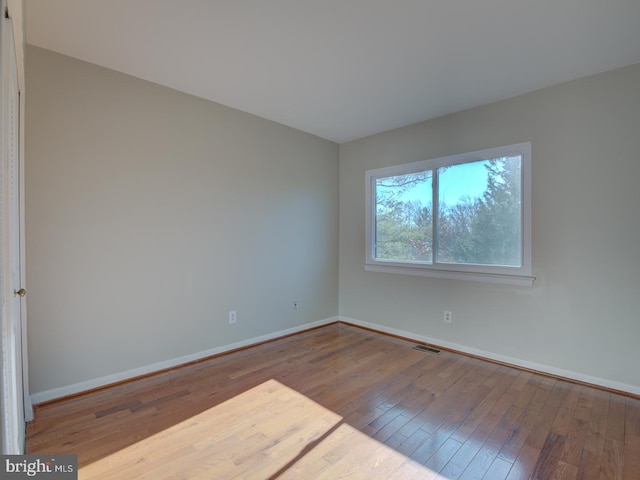 empty room featuring hardwood / wood-style floors