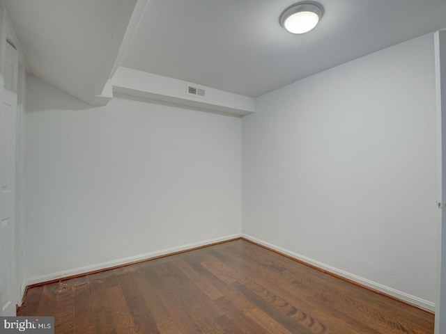 unfurnished room with wood-type flooring