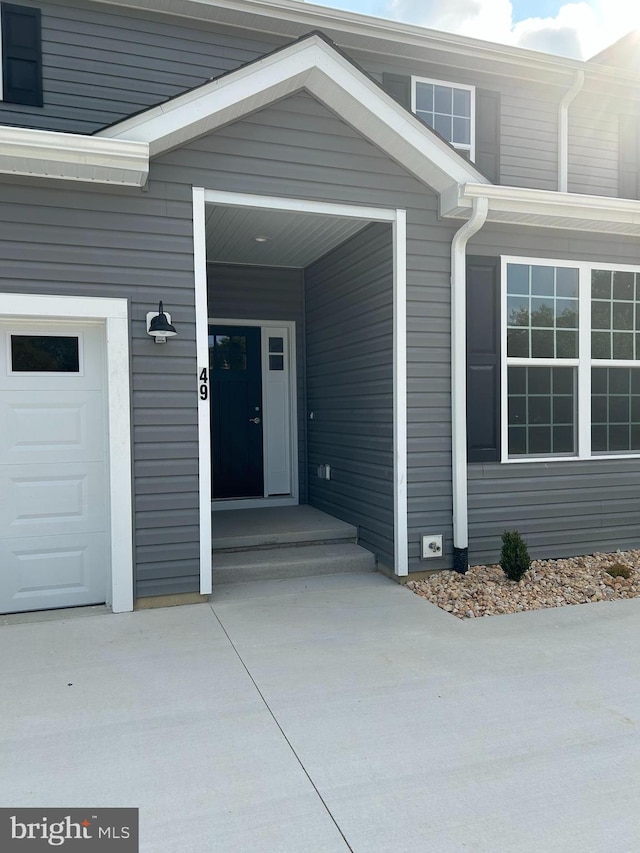 property entrance with a garage