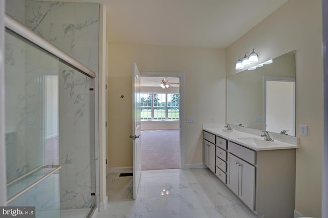 bathroom featuring vanity, ceiling fan, and a shower with shower door