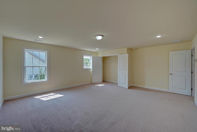 unfurnished bedroom with light carpet