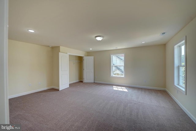 unfurnished bedroom with light carpet