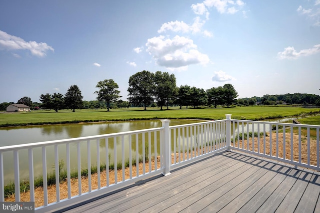 wooden deck with a water view