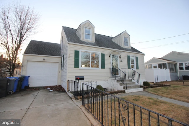 cape cod-style house with a garage