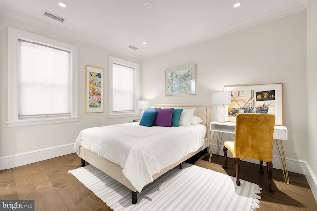 bedroom featuring wood-type flooring and crown molding