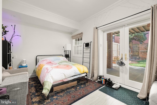 bedroom with access to exterior, ornamental molding, and french doors