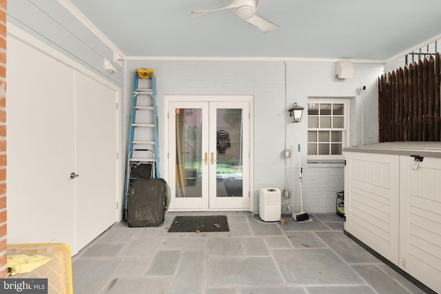 view of exterior entry with french doors, a patio, and ceiling fan