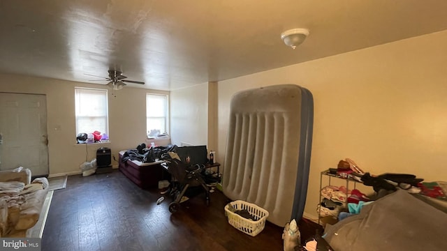 misc room featuring ceiling fan and wood-type flooring