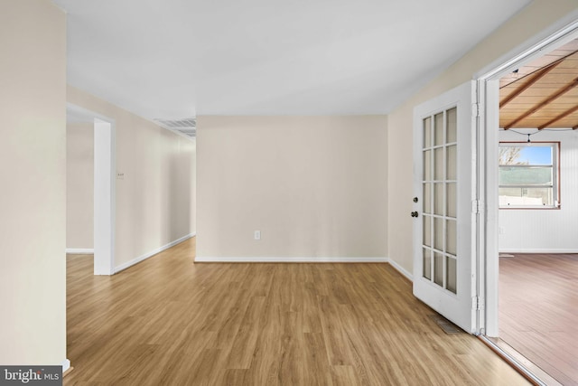 spare room with light hardwood / wood-style floors