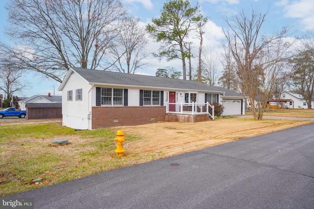 view of front facade featuring a front lawn and a garage