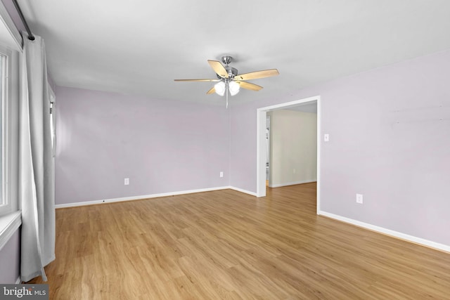 unfurnished room with ceiling fan and light wood-type flooring