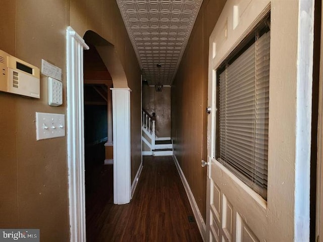 corridor with dark hardwood / wood-style floors