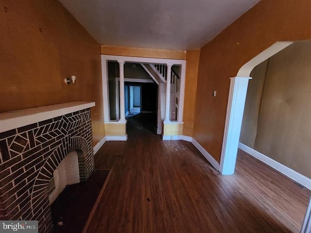 corridor featuring dark hardwood / wood-style flooring