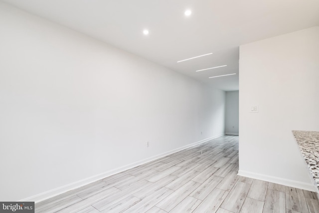 spare room featuring light wood-type flooring