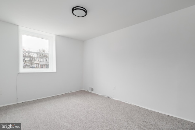 spare room featuring carpet floors