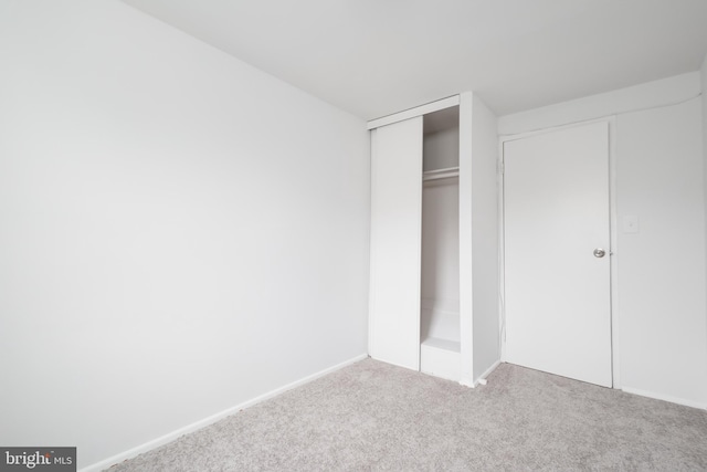 unfurnished bedroom with carpet flooring