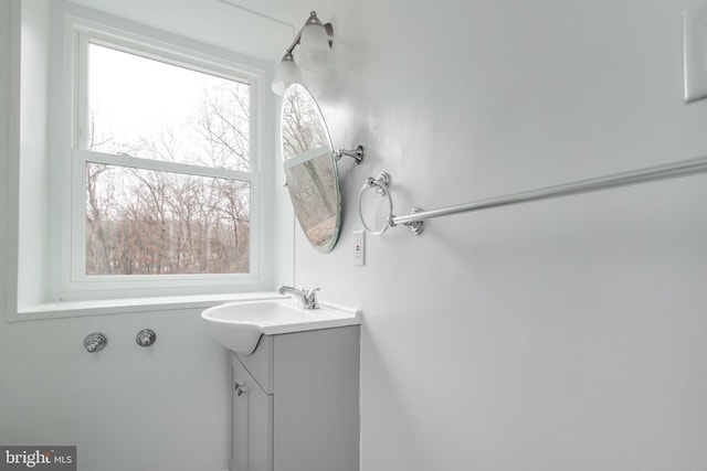 bathroom with vanity and a wealth of natural light